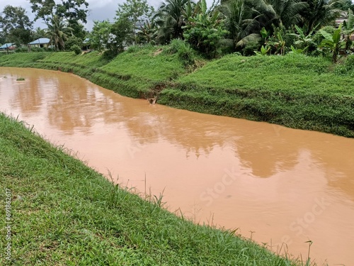 A yellowish  river after heavy rainfall in kluang, johor, malaysia southeast asia
