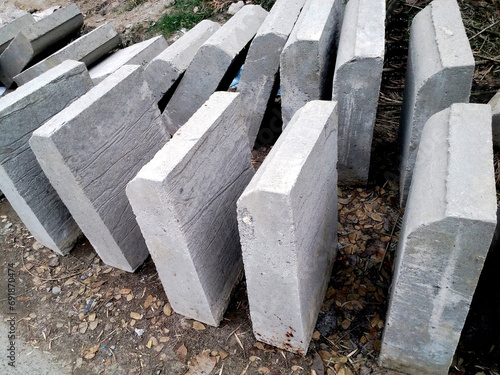 oblong or cube shaped Cement block, concrete for wakling way constructions photo