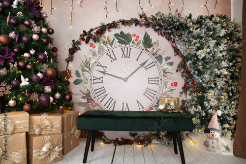 gorgeous Christmas and New Year decor featuring Christmas clock decorated with snowy tree branches and other Christmas decorations: Christmas tree, snowman, gifts photo