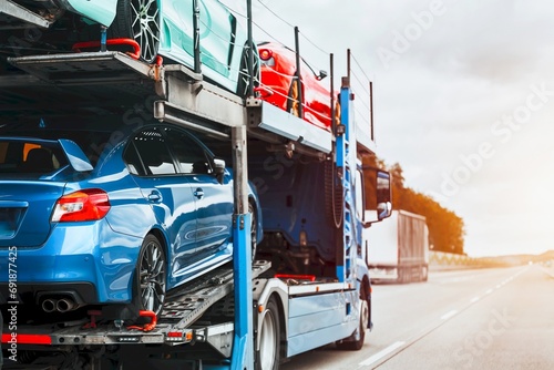Tow truck with a broken car on a road. Tow truck transporting car on the highway. Car service transportation concept. Roadside Rescue.