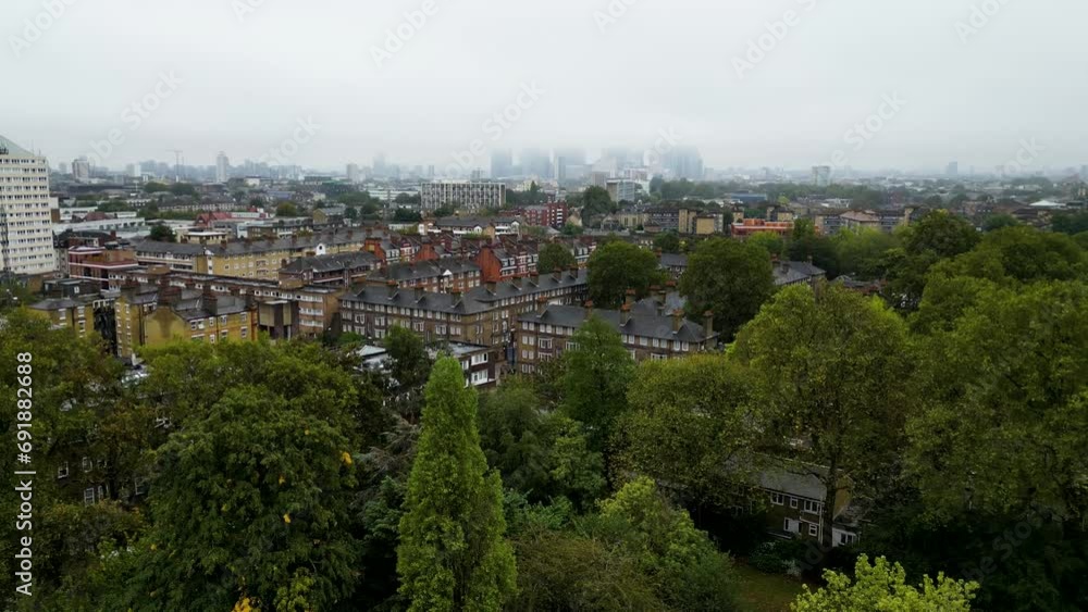 Top cinematic aerial view to the London streets. Drone footage. Flight over London - amazing view over the rooftops - travel videography. Establishing Aerial View Shot of London UK, United Kingdom Top cinematic aerial view to the London streets. Drone footage. Flight over London - amazing view over the rooftops - travel videography. Establishing Aerial View Shot of London UK, United Kingdom