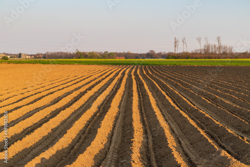 campo arato in pianura padana photo