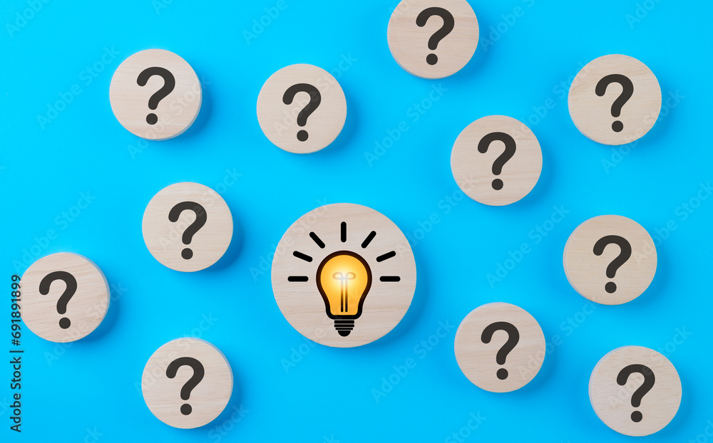 Problem solving concept. Question mark and light bulb icons on round wooden on blue background. Creative thinking, innovation, and idea, Business solution company, Find solution, Step idea process, Problem solving concept. Question mark and light bulb icons on round wooden on blue background. Creative thinking, innovation, and idea, Business solution company, Find solution, Step idea process,