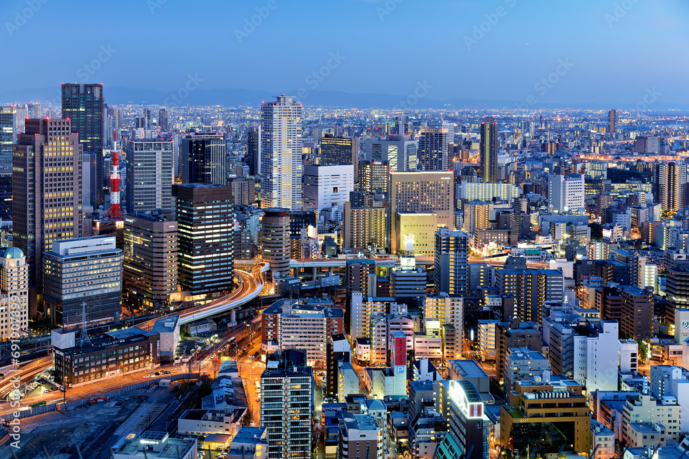 Naklejka premium Japan. Kansai. Osaka. The business financial district at dusk