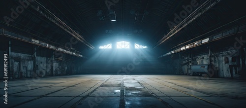 Abandoned soviet hangar built for keeping ballistic missiles in Cold War times Hangar with light painted interior. Copy space image. Place for adding text photo