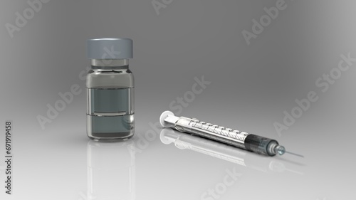 Insulin Syringe and Vial of Liquid: Tools for Diabetes Control photo