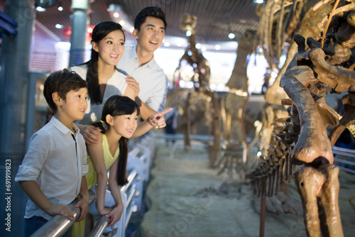 Young family in museum of natural history photo