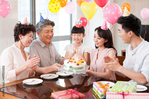 Happy family celebrating birthday photo