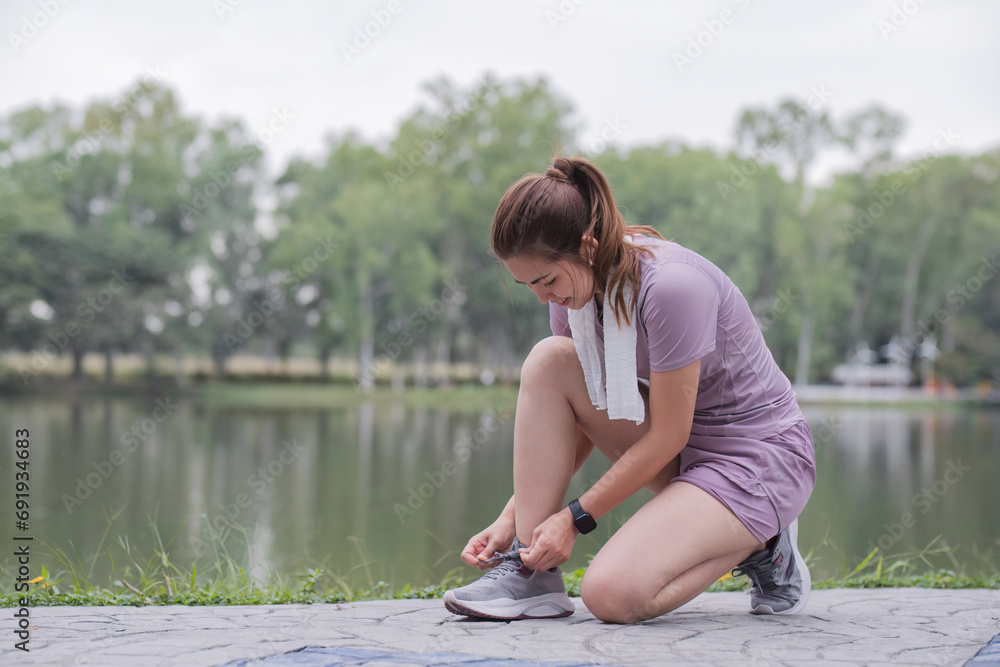 Young woman exercising in the park Prepare for health care