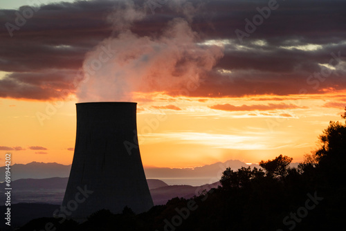 Tableau sur toile Sunset on the cooling chimney of the boraciferous blowers