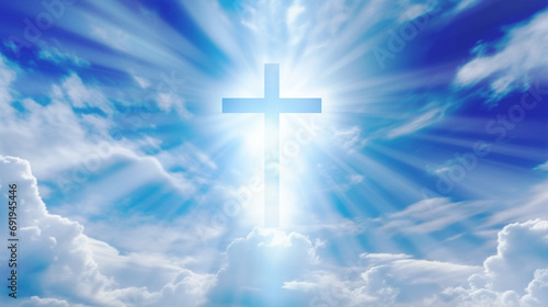 Christian cross with god ray on blue sky photo