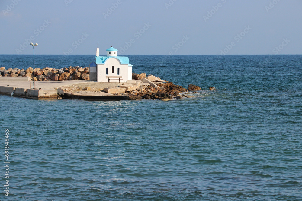 orthodox church (agios dionysios d'olymbos) and mediterranean sea in galatas in crete in greece 