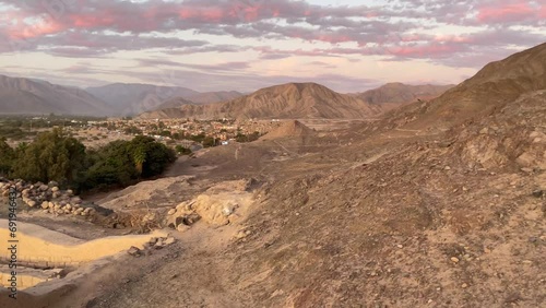 Peru, Nazca, sunset over Incas ruin Los Paredones photo