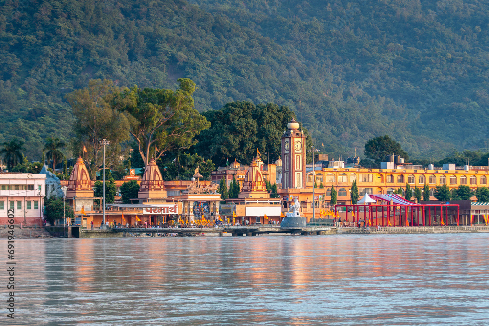 views of rishikesh city crossed by ganges river, india
