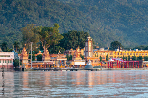 views of rishikesh city crossed by ganges river, india photo
