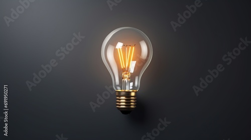 Close-up of white lightbulb on grey background with copy space