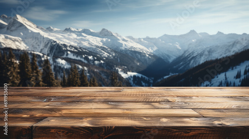 Empty space wooden plank table terrace with Christmas background. Wood rustic table top perspective in front of winter snow natural mountain blur background setup for product display 