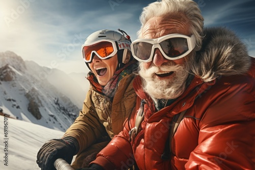  a man and a woman riding on the back of a snow covered ski slope with skis on their shoulders.