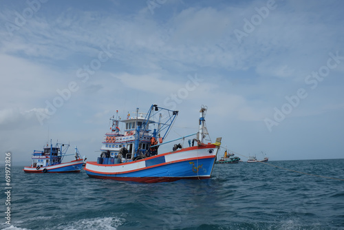 Thai fishing boat sailing on the sea with beautiful clear sky on Koh Samaesarn. Sattahip, Chonburi, Thailand