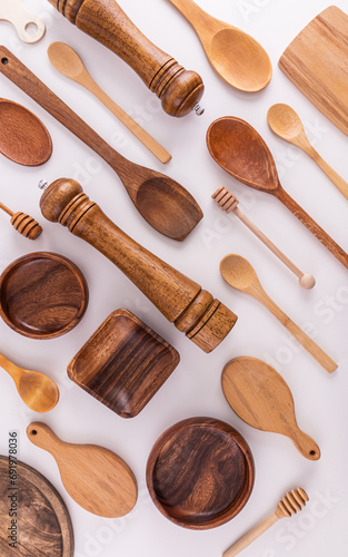 Various kinds of kitchen utensils made of wood eco-friendly materials on a white background. Flat parallel laying. Vertical view. cover. layout.