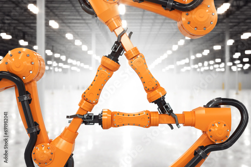 Robot arms are holding each other, as a sign of strength and teamwork. 3D rendering on industrial background.