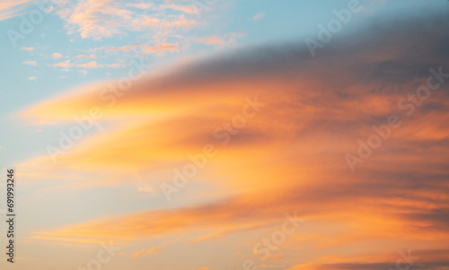 Beautiful bright summer sunset sky with clouds. Nature sky background.
