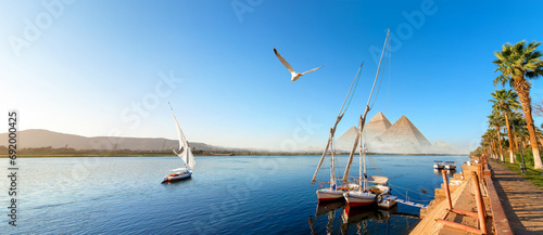 Sailboat in Aswan and pyramids