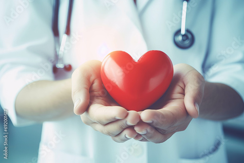 Heartfelt care: Doctor holding a red heart shape, symbolizing love and health. Ideal for World Heart Day and insurance concepts. ai generative photo