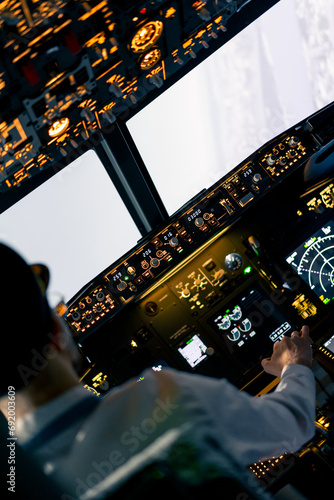 The pilot in the cockpit controls the plane during flight turbulence flight simulator and transportation
