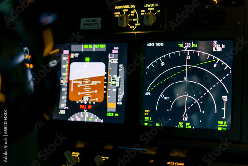 Close-up of an airplane cockpit Center panel with main flight display and navigation display Airplane pilot panels