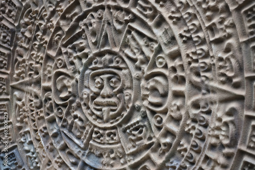 Ancient Mayan Calendar or Aztec calendar with rough relief surface outdoors