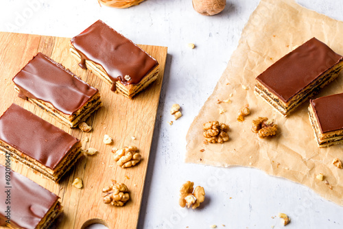 Gerbeaud Cake. Zserbo. Traditional Hungarian multi-layer cake with plum jam, nuts and covered with chocolate glaze
