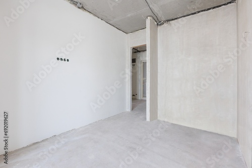 interior of the apartment without decoration in gray colors. rough finish