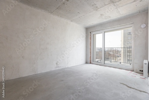 interior of the apartment without decoration in gray colors. rough finish