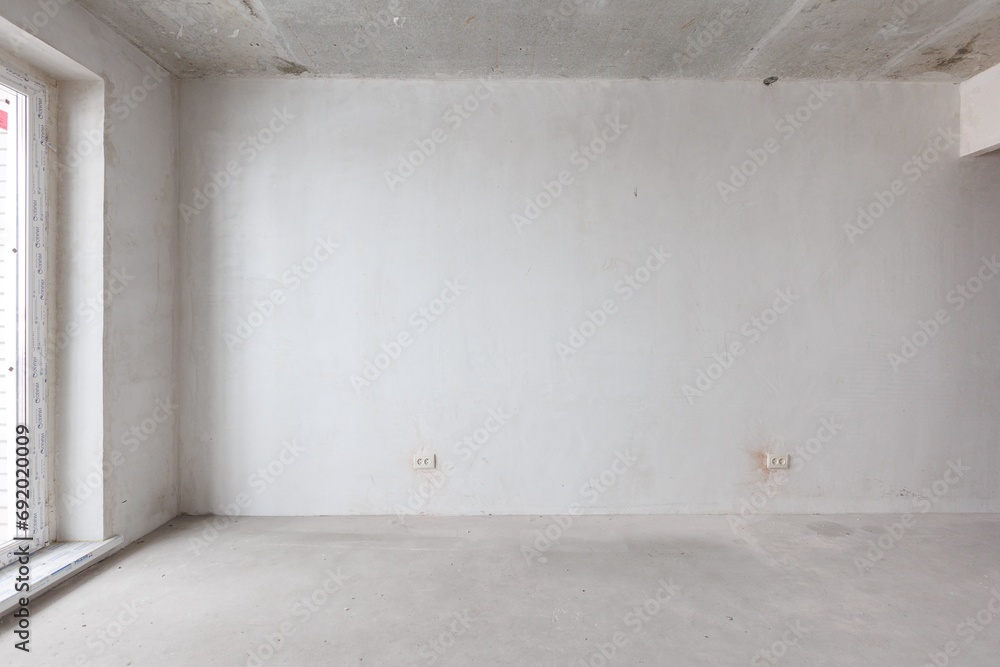 interior of the apartment without decoration in gray colors. rough finish interior of the apartment without decoration in gray colors. rough finish