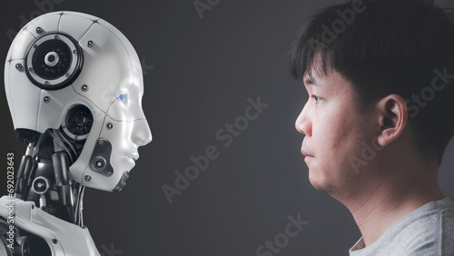 Bild auf Leinwand The faces of human and a robot on opposite sides Looking at each other, Modern AI technology concept, humans and robots, competition between human intelligence and artificial intelligence