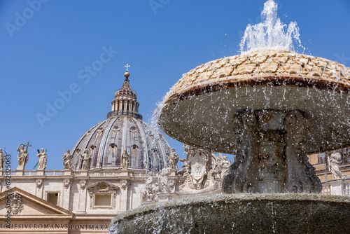 one of the two fountains on St. Peter's Square in Vatican City, created by Carlo Maderno (1612–1614) and Giovanni Lorenzo Bernini (1667–1677) to ornament the square in front of the St. Peter's Basilic photo