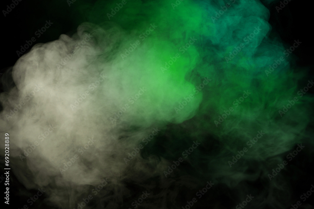 Green and white steam on a black background. Green and white steam on a black background.
