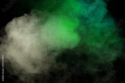 Green and white steam on a black background. © Nikolay