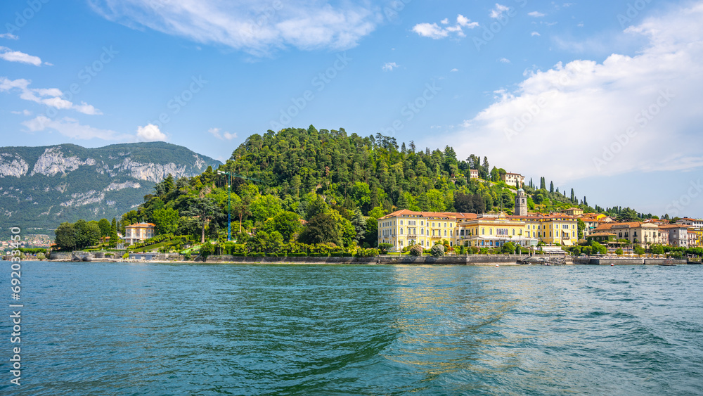 Bellagio town at Como Lake on sunny summer day. Idyllic view from ferry. Lombardy, Italy