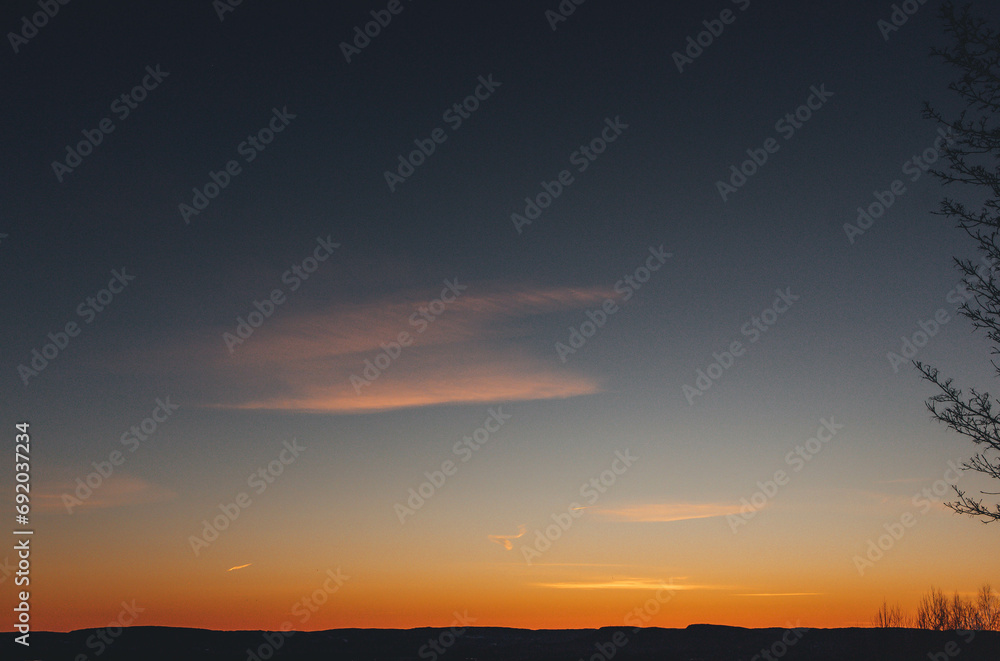 sunset in the mountains from the hill with view of oslo fjord
