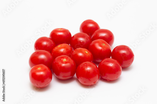 Cherry tomatoes on white isolated background