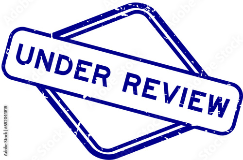 Grunge blue under review word rubber seal stamp on white background