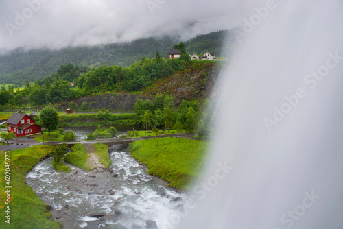 Steinsdalsfossen waterfall in the village of Steine, Norway photo