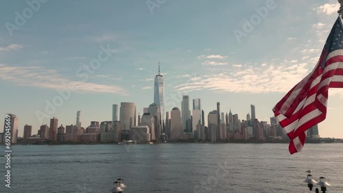 USA American flag. Memorial Day, Veteran's Day, July 4th. American Flag Waving near New York City, Manhattan view. 4th of July with American flags, Independence Day. American flags waving against NYC.