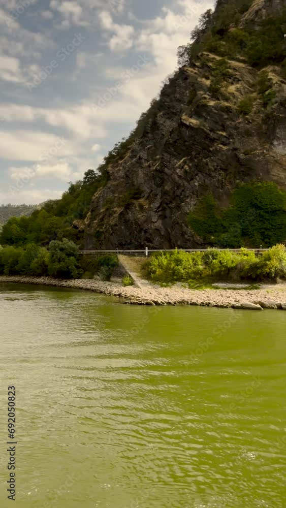 Traveling along the Rhine River with scenic views of the medieval landscape of St. Goarshausen, Germany and the Loreley slate rock. Located Rhine Gorge (Middle Rhine). Traveling along the Rhine River with scenic views of the medieval landscape of St. Goarshausen, Germany and the Loreley slate rock. Located Rhine Gorge (Middle Rhine).