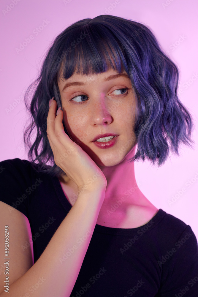 portrait of a beautiful girl with short blue hair on a purple background portrait of a beautiful girl with short blue hair on a purple background