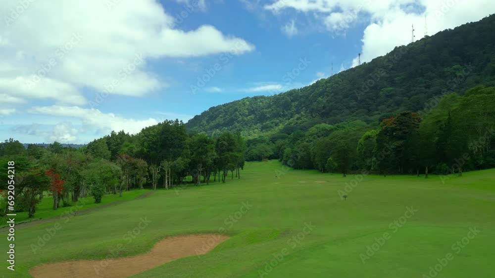 Golf fields on a Handara golf club on sunny summer day. Aerial drone view of the green golf course. Golf fields on a Handara golf club on sunny summer day. Aerial drone view of the green golf course.