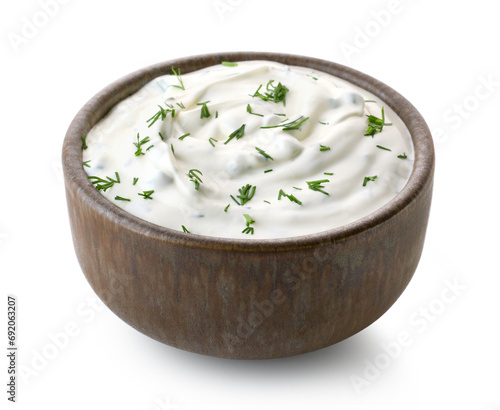 Fotografie Brown ceramic bowl of fresh sour cream dip sauce with herbs