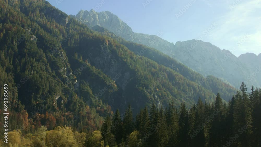 Scenic view of densely forested Italian mountains on a sunny day. Scenic view of densely forested Italian mountains on a sunny day.